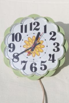 70s vintage GE electric wall clock, retro avocado green plastic daisy kitchen clock