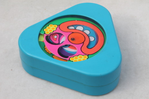 70s vintage Mattel baby toy, spinning face clown psychedelic color spirals