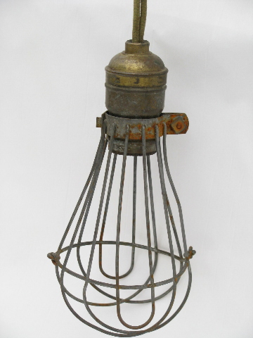 Early industrial vintage, drop pendant light with wire cage and porcelain ceiling cap