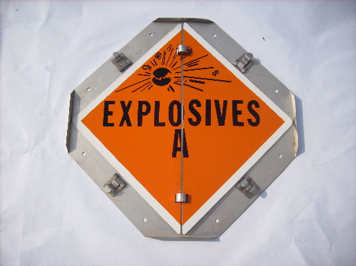 Explosives! Warning flip sign in safety orange