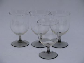 Four wine glasses, smoke grey & crystal glass stemware goblets