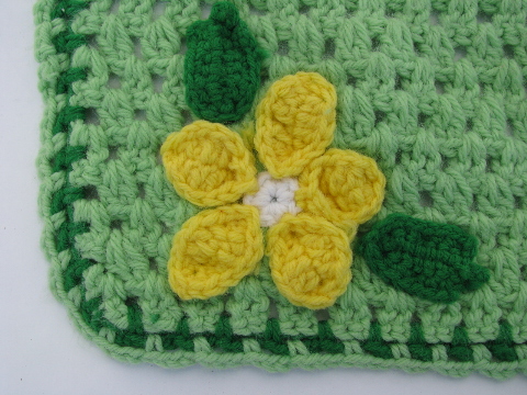 Hand-crocheted kitchen placemats, retro daisies on jade green