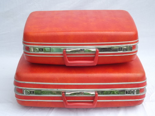 Retro orange Samsonite hard sided suitcases, vintage luggage set