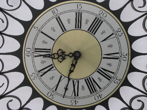 Retro vintage black metal atomic starburst clock, gothic mod