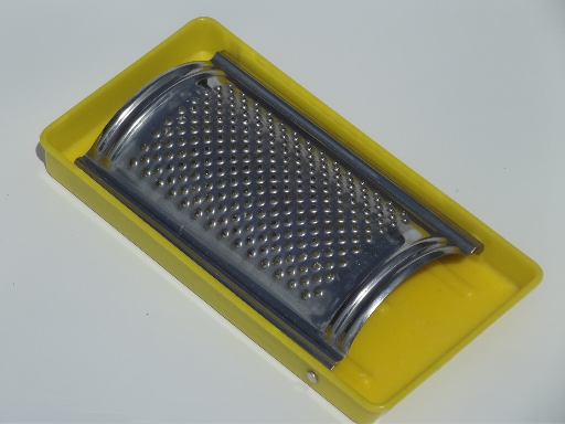 Retro vintage yellow plastic folding tray grater for kitchen or camper