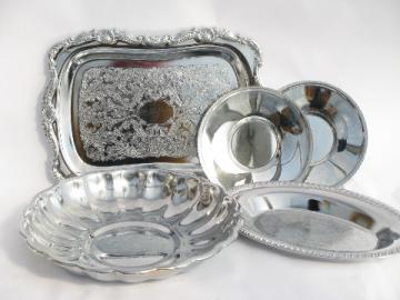 Stack of shiny silver chrome plate trays, vintage 1950s-60s