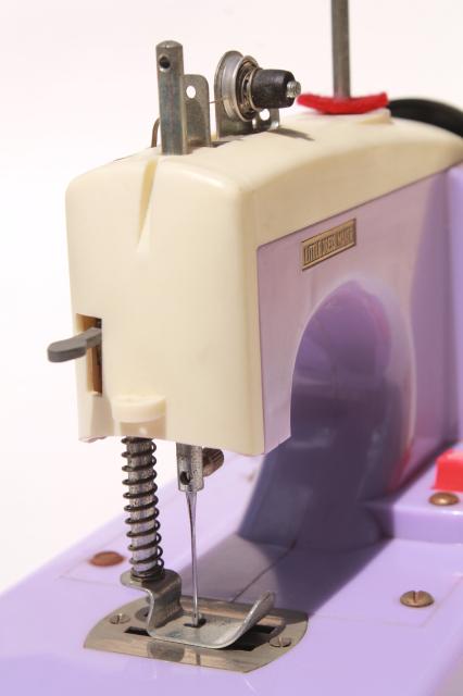 vintage Japan toy sewing machine in lavender purple plastic - needs restoration work