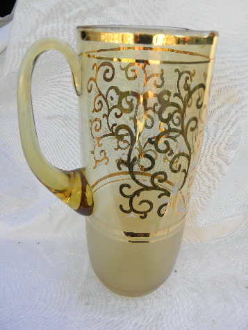 Vintage barware, tall thin drinks pitcher, pale amber glass w/ gold