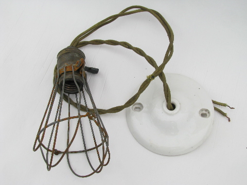 Early industrial vintage, drop pendant light with wire cage and porcelain ceiling cap