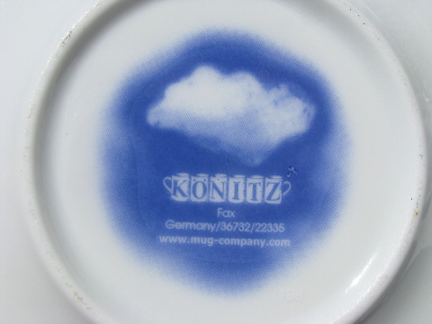Fluffy white clouds on blue sky Germany china espresso cups and saucers
