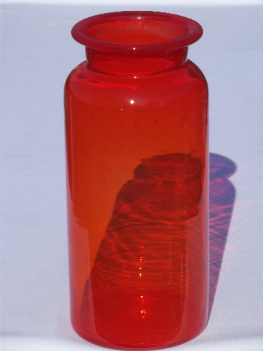 Huge vintage orange glass bottle, tall apothecary canister jar shape