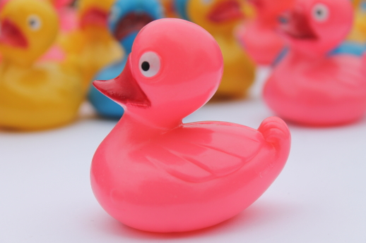 Lot of 24 'rubber' ducks in pink, blue, yellow - vintage China hard plastic toys