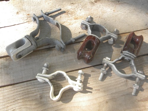 Lot of machine-age industrial vintage ceramic insulators w/steel clamps