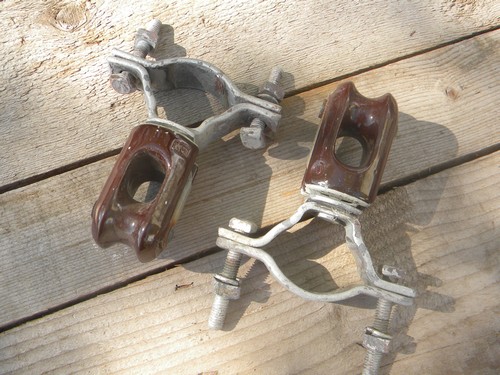 Lot of machine-age industrial vintage ceramic insulators w/steel clamps