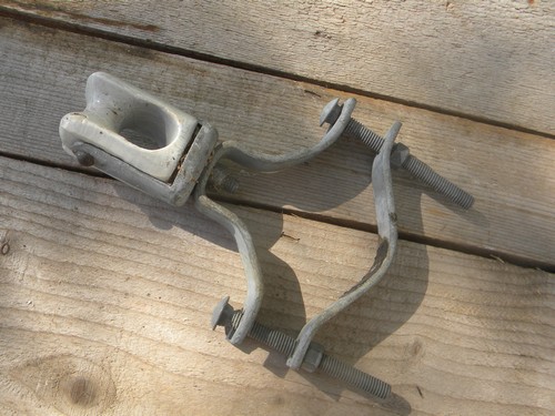 Lot of machine-age industrial vintage ceramic insulators w/steel clamps