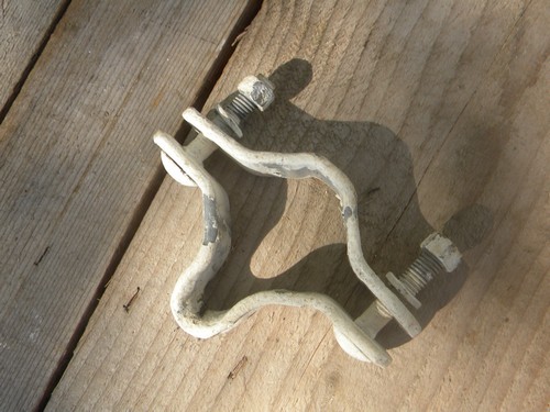 Lot of machine-age industrial vintage ceramic insulators w/steel clamps