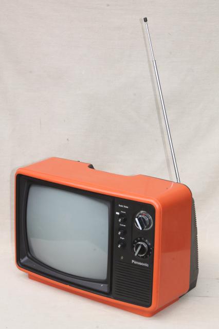 retro  mod orange TV set, 1970s portable television w/ rabbit ear antenna