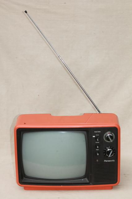 retro  mod orange TV set, 1970s portable television w/ rabbit ear antenna