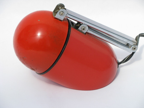 Retro mod red-orange bullet shape reading or desk light, folds to capsule
