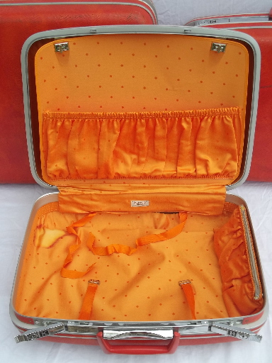 Retro orange Samsonite hard sided suitcases, vintage luggage set