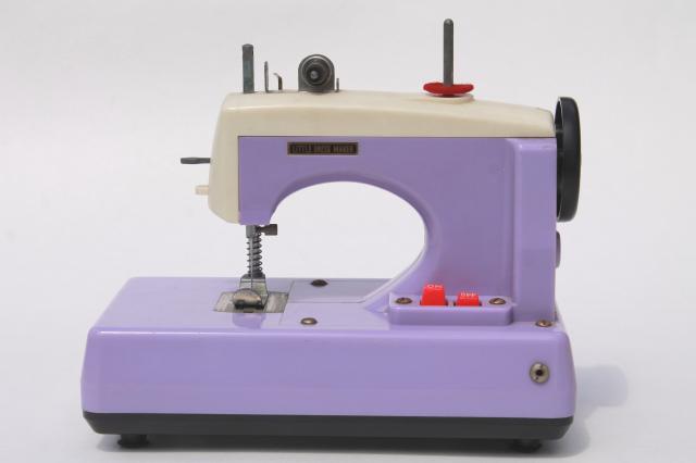 vintage Japan toy sewing machine in lavender purple plastic - needs restoration work