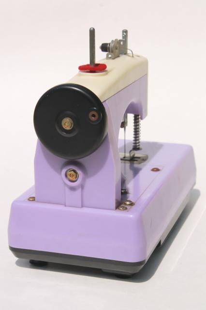 vintage Japan toy sewing machine in lavender purple plastic - needs restoration work