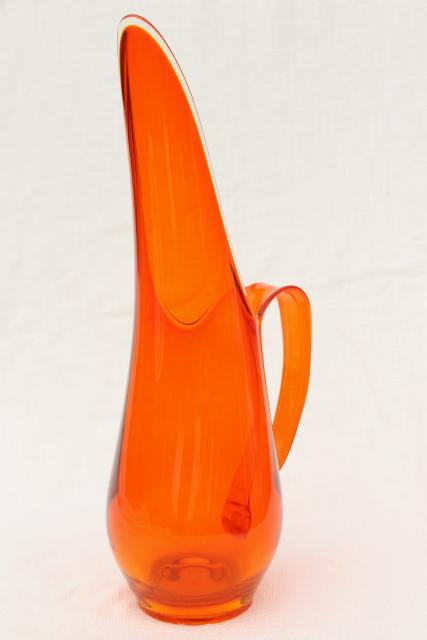 Unmarked vintage Viking glass pitcher in a rich orange color, hand blown ar...