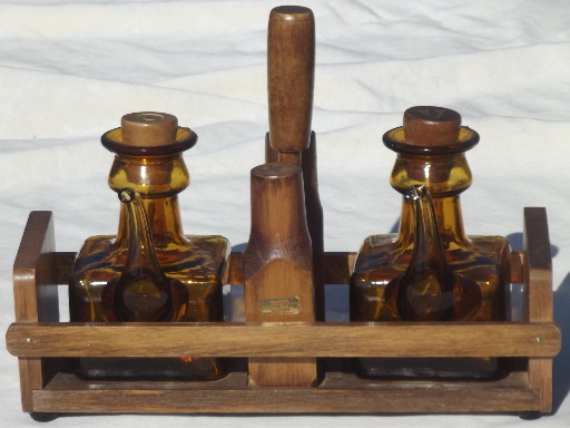 Vintage amber glass hand-blown cruet bottles in rustic wood table set