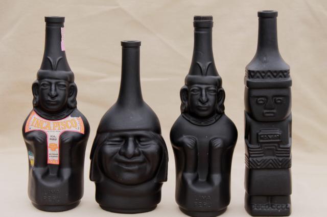 vintage black glass Inca Pisco bottles, tiki style indian heads & totem