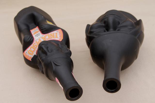 vintage black glass Inca Pisco bottles, tiki style indian heads & totem