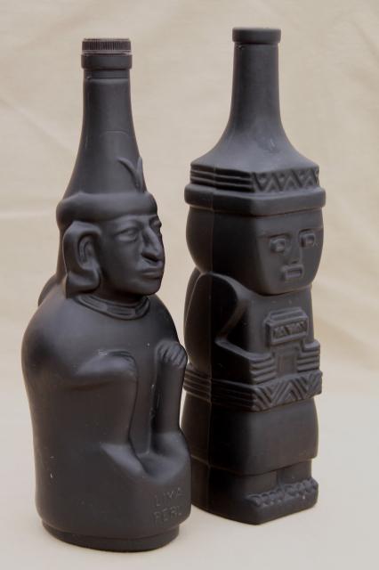 vintage black glass Inca Pisco bottles, tiki style indian heads & totem