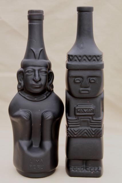 vintage black glass Inca Pisco bottles, tiki style indian heads & totem