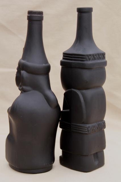 vintage black glass Inca Pisco bottles, tiki style indian heads & totem