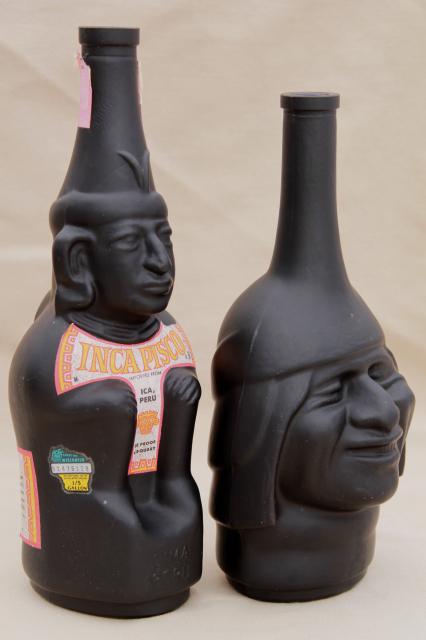 vintage black glass Inca Pisco bottles, tiki style indian heads & totem