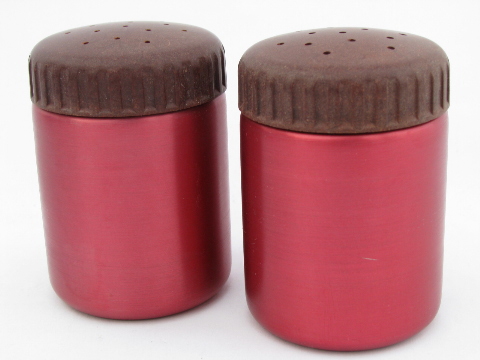 Vintage red anodized aluminum salt and peppers, Bakelite lids