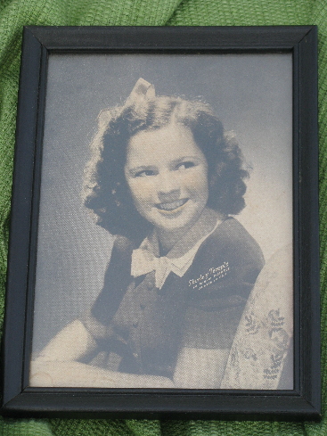 Vintage Shirley Temple colored photo print in period wood frame