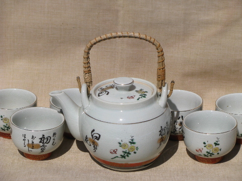 Wicker handle pottery teapot and bowl cups, vintage Japan painted tea set
